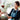 Florist handing over an elegant flower bouquet featuring fresh roses and baby's breath, thoughtfully arranged as a personalised floral gift for birthdays, anniversaries, and special occasions in Singapore.