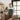 Florist preparing a fresh flower arrangement for flower delivery in Singapore, carefully packing white blooms to ensure a thoughtful and reliable delivery experience.