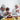 Muslim family sharing prayers and festive meal at home during Hari Raya celebration in Singapore with traditional food and gifts.