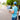 Flower delivery service in Singapore with florist courier holding a bouquet and tablet for online flower orders and same day delivery.