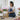 Florist carefully preparing and packing a fresh flower order for same day flower delivery, ensuring every bouquet arrives beautifully presented and on time in Singapore.