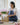 Florist carefully preparing and packing a fresh flower order for same day flower delivery, ensuring every bouquet arrives beautifully presented and on time in Singapore.