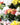 Florist carefully preparing and packing a fresh flower order for same day flower delivery, ensuring every bouquet arrives beautifully presented and on time in Singapore.